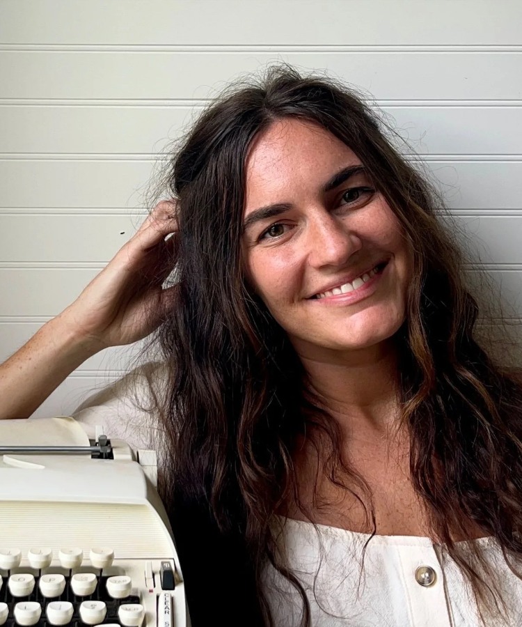 A professional headshot of author Allie Millington, smiling warmly in a creative and approachable portrait.