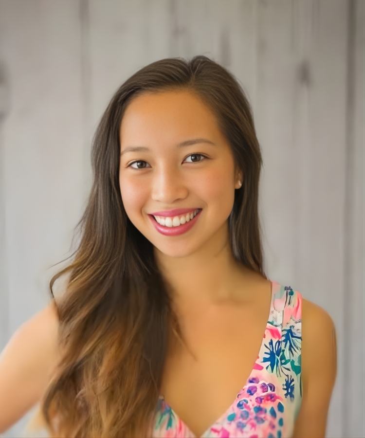 A professional headshot of author Katrina Moore, smiling brightly in a warm and welcoming portrait.