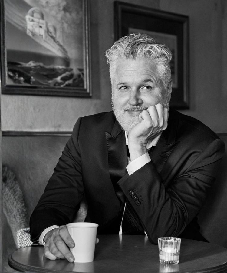 Michael Buckley, bestselling author of The Sisters Grimm and The Weirdies, in a professional headshot.