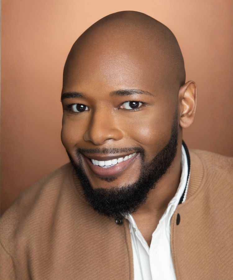 A professional headshot of author Terry J. Benton-Walker, smiling warmly in a friendly and professional portrait.