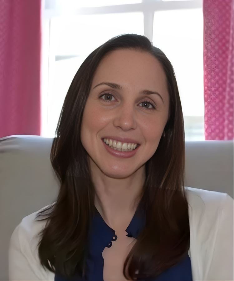 A professional headshot of author Christyne Morrell, smiling warmly in a friendly and approachable portrait.