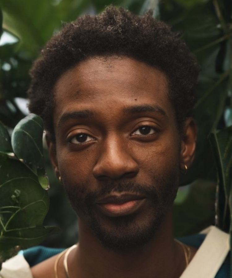 A professional headshot of author H. D. Hunter, smiling warmly in a friendly and approachable portrait.